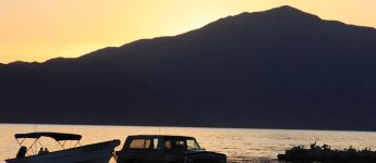 Jeep Cherokee during the sunrise at Bay of LA, Baja Mexico